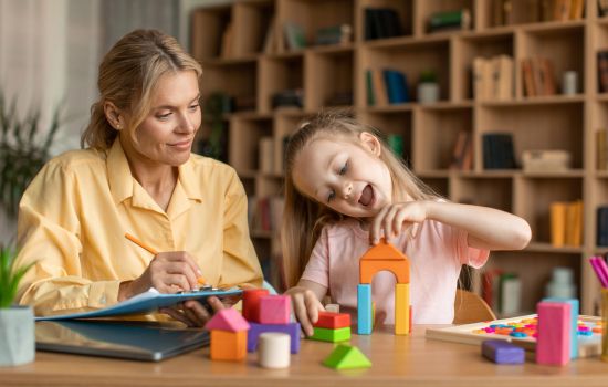 psychology specialist talking to child